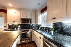 Black Quartz Counter Tops Sparkle With Under Cabinet Lights Rental Home in Greenville